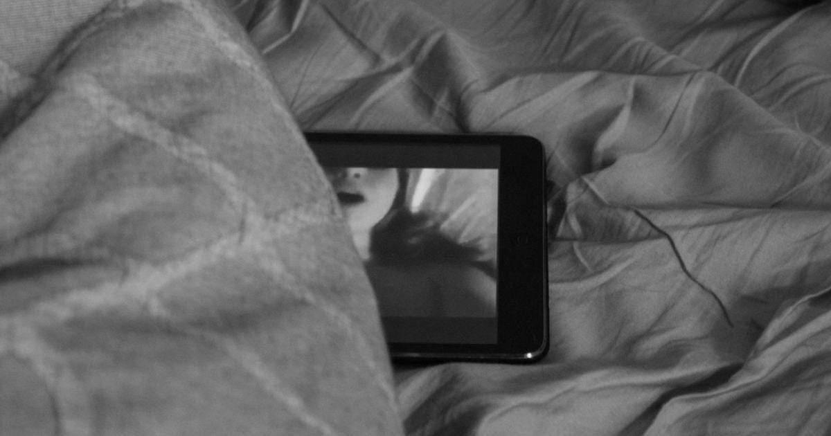 mobile phone in the bed